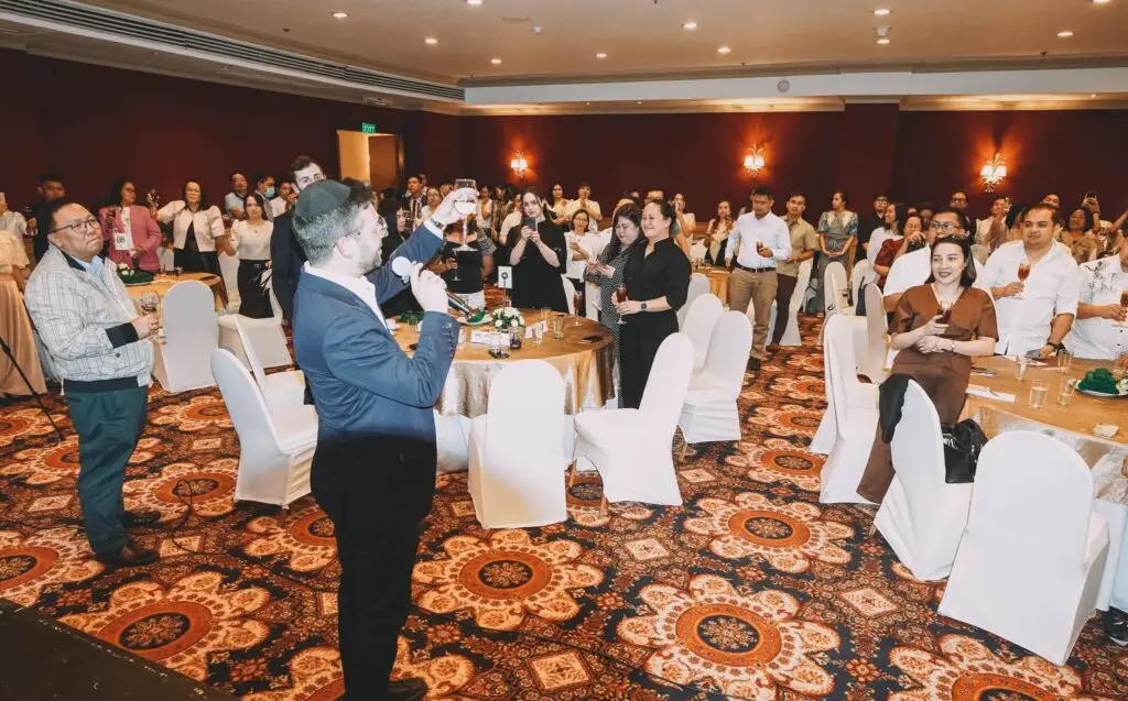 Employees toast to Grandison Gold Standard